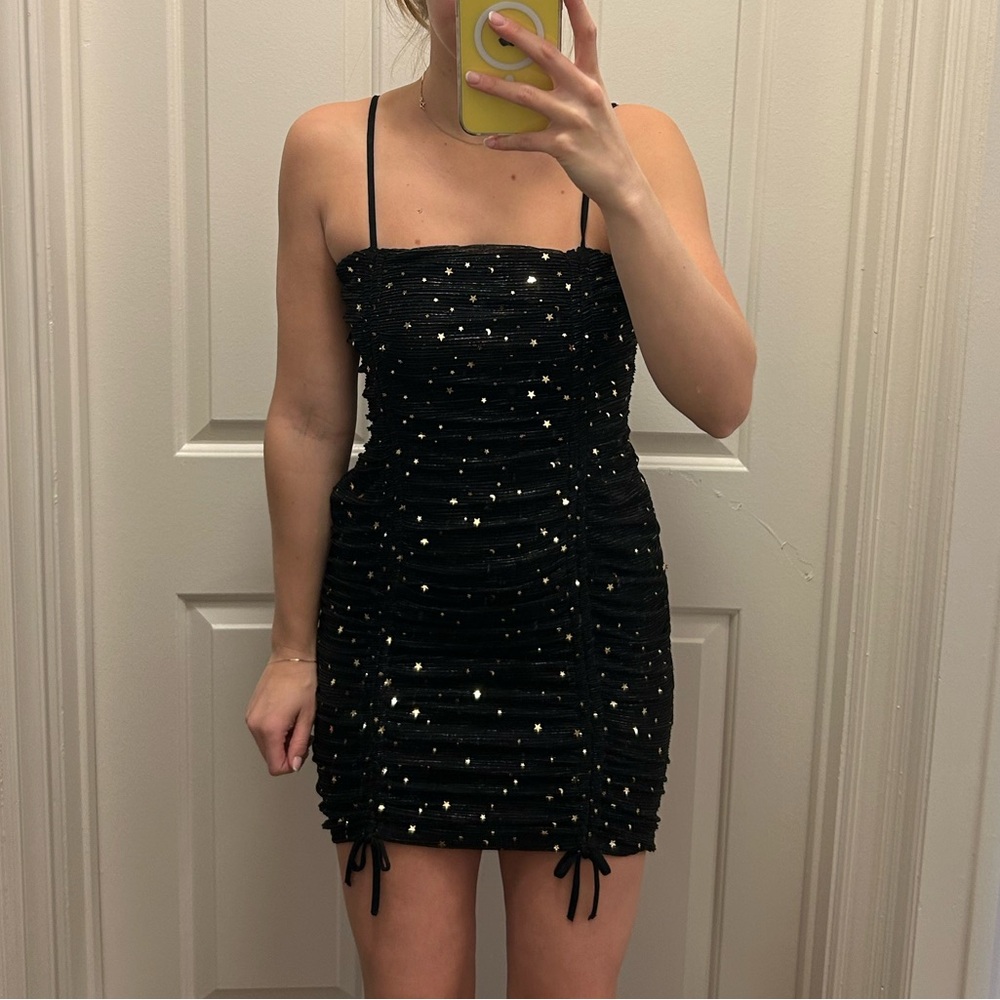 Black dress with gold stars
